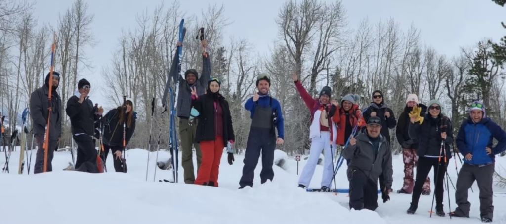 The Camina Conmigo team excited about Nordic Skiing. Pictured in the snow with their ski equipment. 