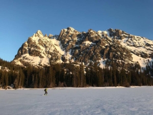 GTNP Ski and snowshoe trip - image of solo skate skier on Jenny Lake