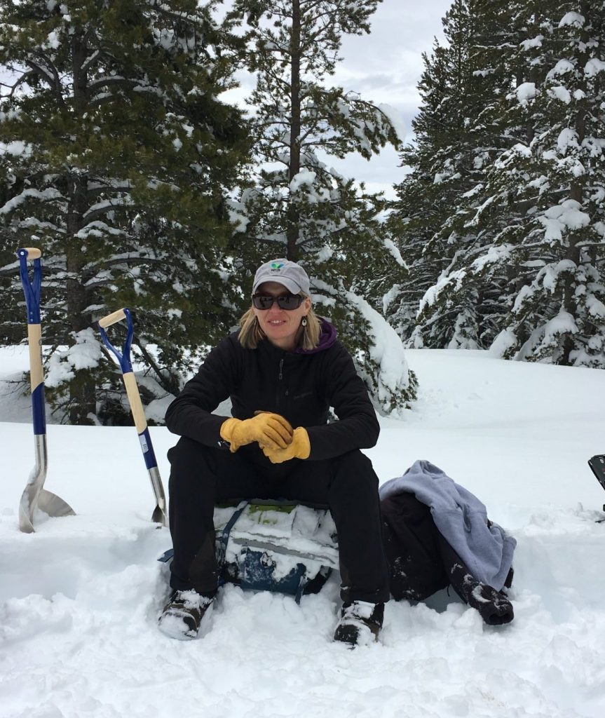 Renee Seidler, Jackson Hole Wildlife Foundation Executive Director takes a rest during winter wildlife research