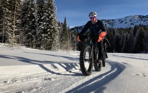 two fat bikers power up the trail