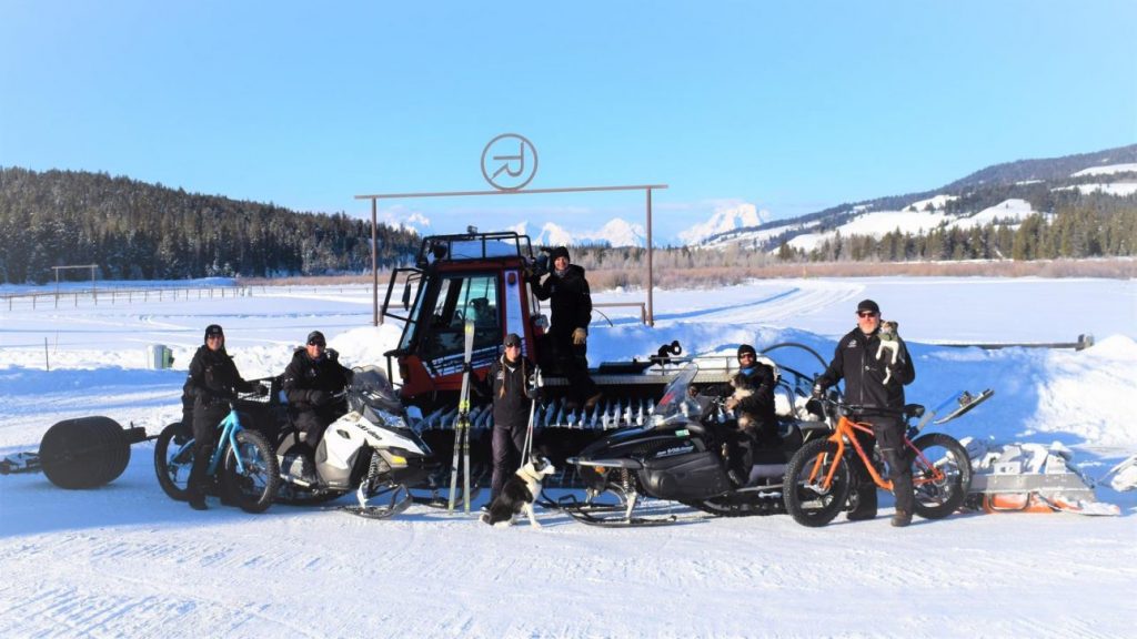 Winter recreationists pose in front. ofTurpin Meadow Ranch