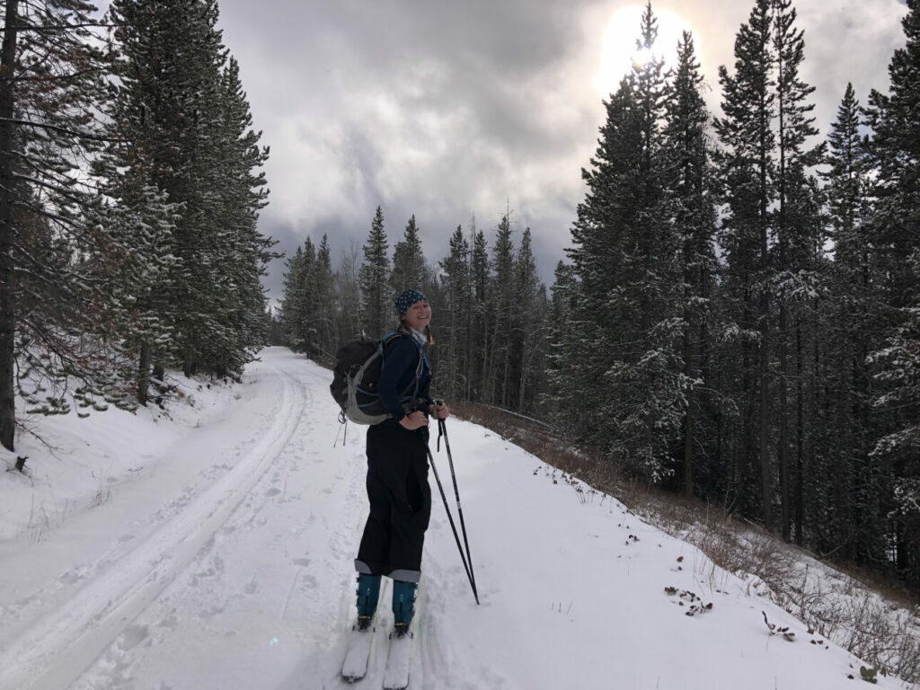 Female Gen Z Nordic skier smiling on the Nordic trail