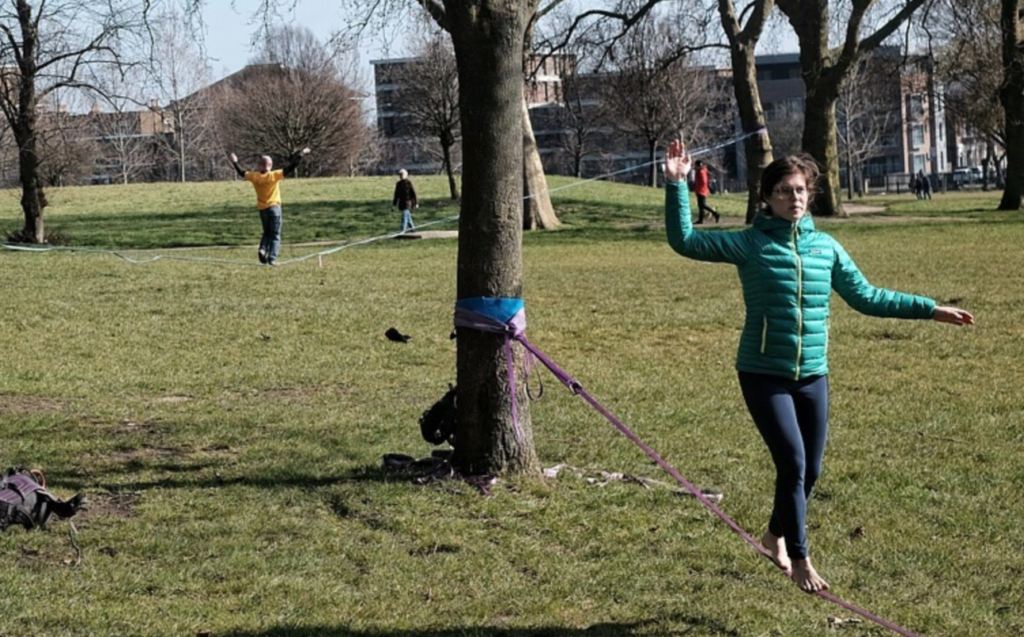 Get in shape for Nordic skiing - Image of slackliners working on balance