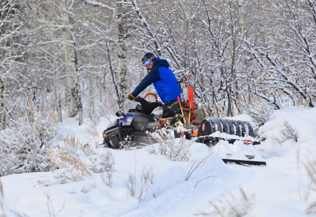 Snowmobile image and singletrick grooming begins