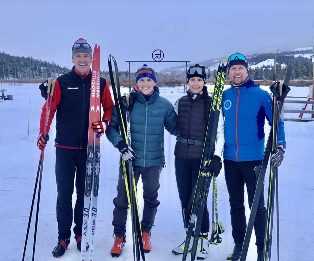 Nordic skiiers pose together for a picture