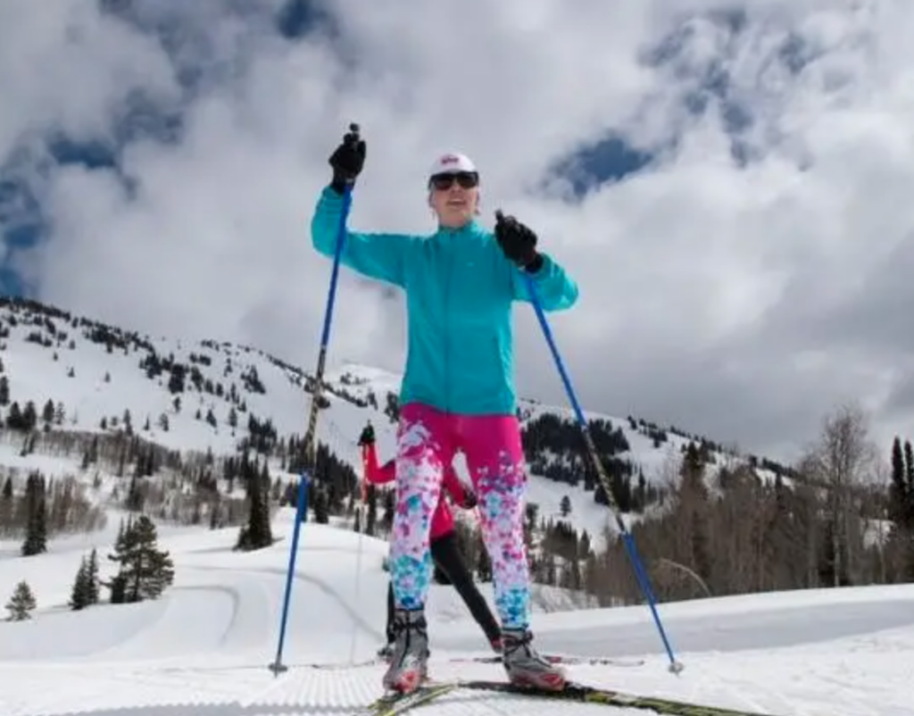 A skier in a bright outfit skate skis at Grand Targhee 