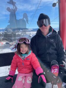 Ali Cohane's Husband, Kevin, and daughter, Millie, pictured riding the gondola at JHMR