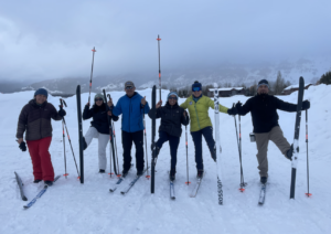 Camina Conmigo team poses for a group photo while Nordic skiing