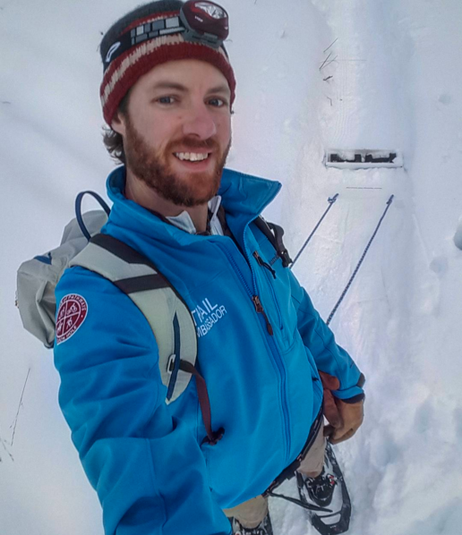 Chris Owen grooms the fat bike track on foot