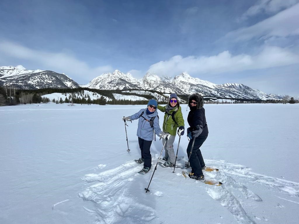 a group of cross-country skier friends pose for a picture in Grand Teton National Park