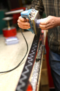 waxing skis at the Skinny Skis tuning shop 