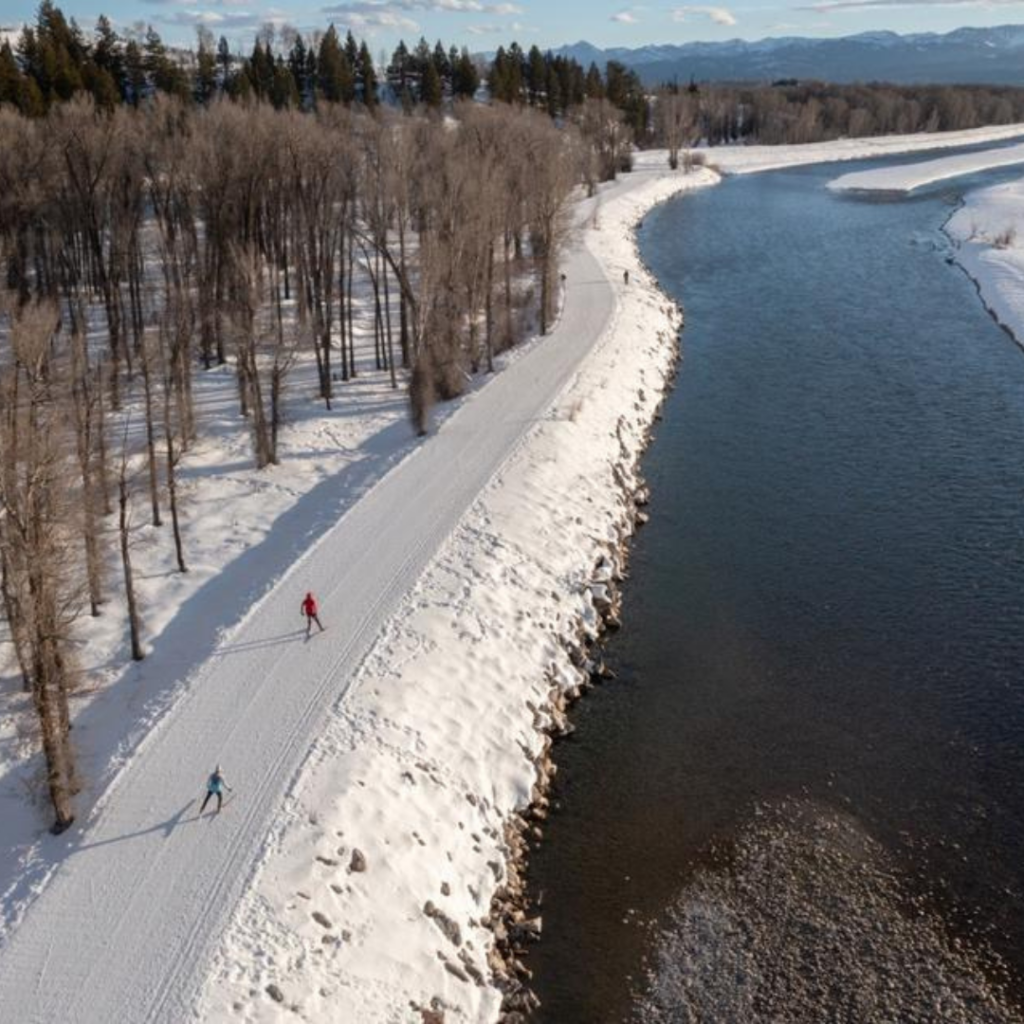 drone photo of Nordic skiiers at Emily's Pond in Jackson