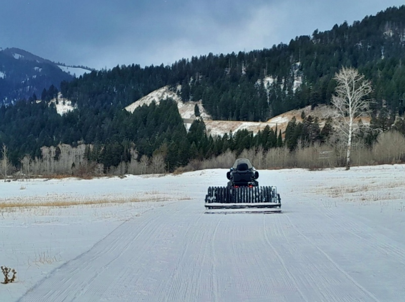 The roller in the fields at Trail Creek creating some corduroy on the thin but growing snowpack