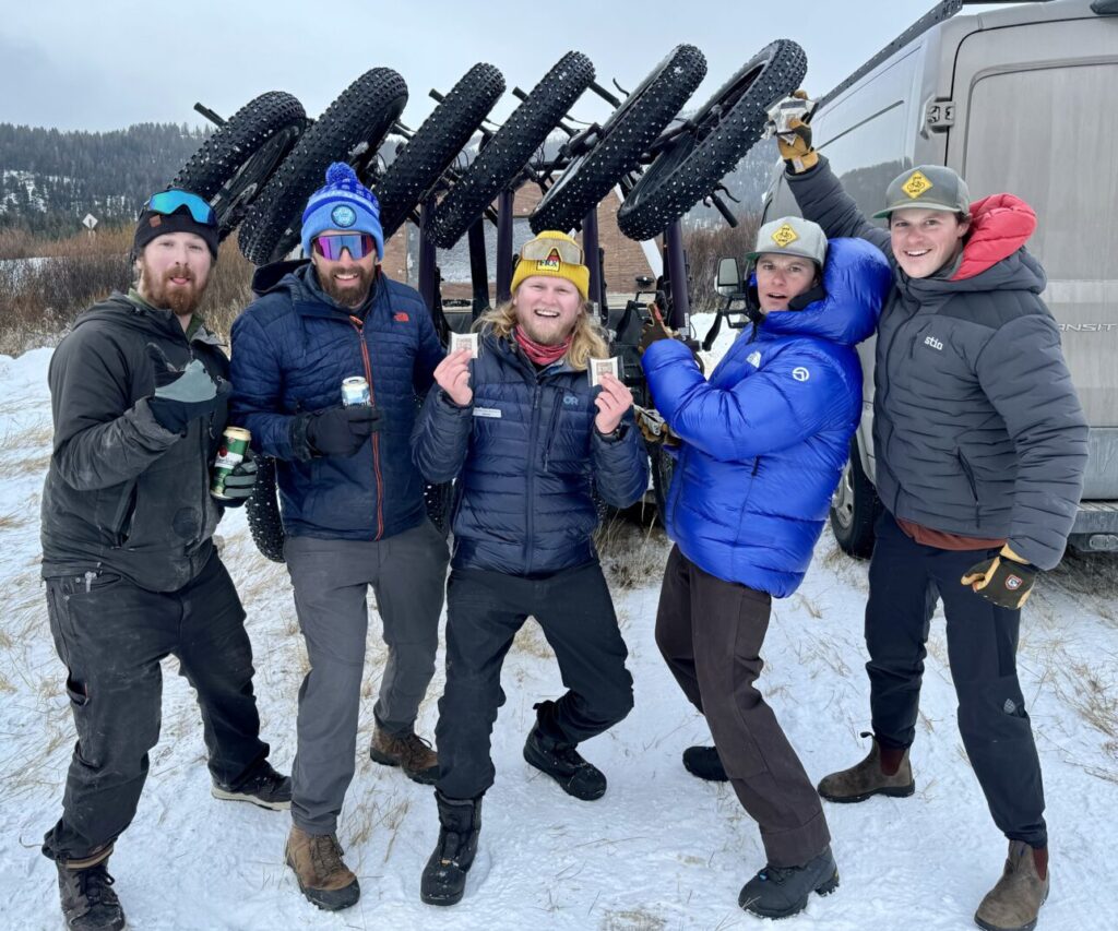 Five happy people with their fat bikes