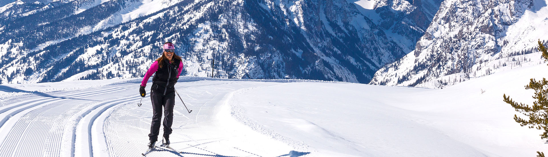 woman cross country skiing on groomed track
