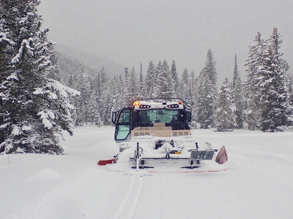 picture of trail creek groomer on a snow day