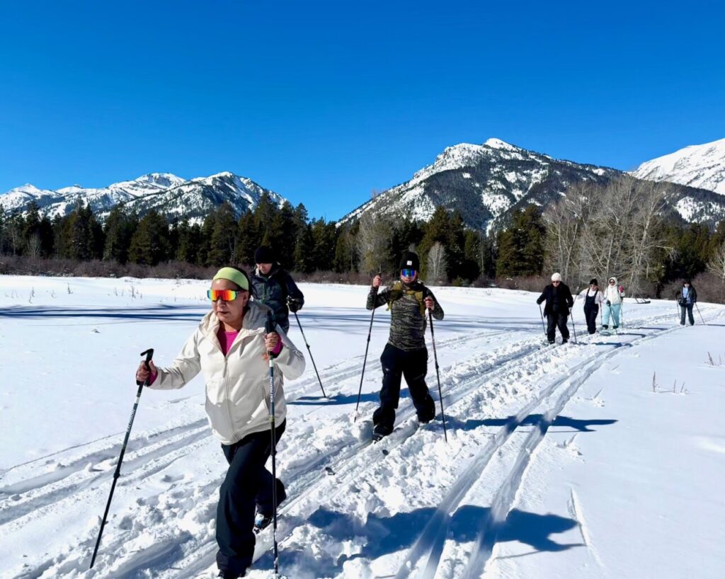 Blue skies and Camino Conmigo skiers